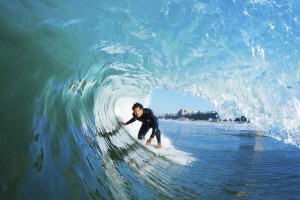 Surfer On Blue Ocean Wave